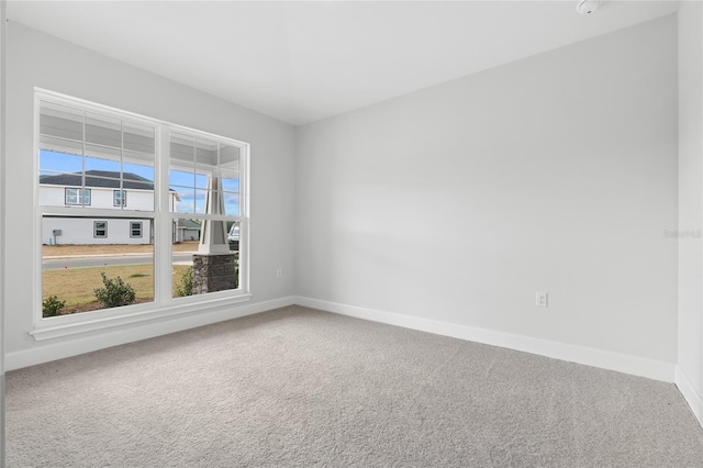 empty room with carpet flooring