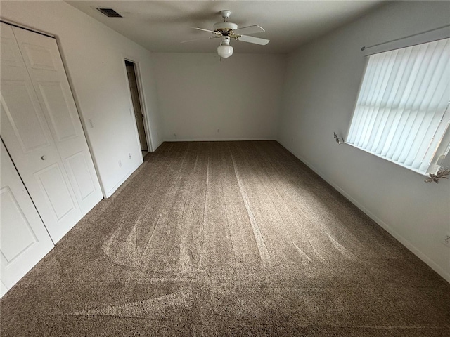 unfurnished bedroom featuring carpet flooring and ceiling fan