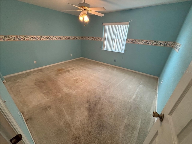 empty room with light carpet and ceiling fan