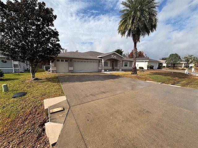 single story home featuring a front yard and a garage