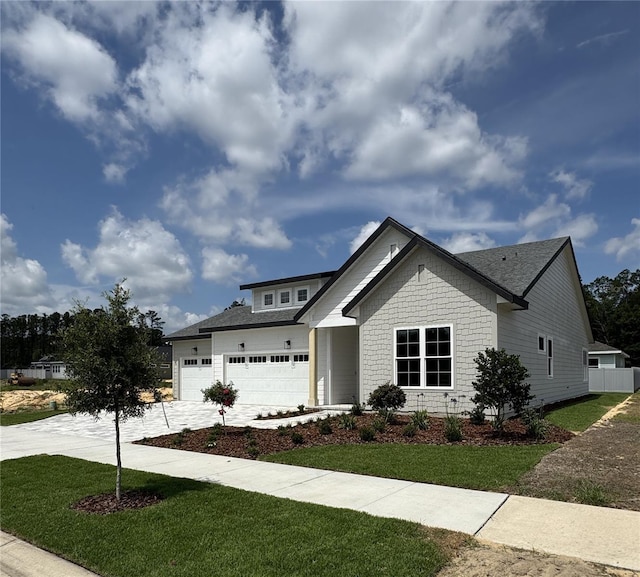 804 SW 144th Dr, Newberry, FL 32669 - view of front of home featuring driveway, a front yard, and a garage