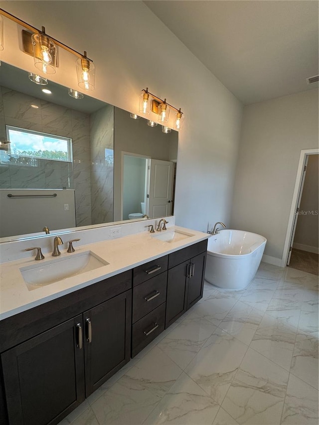 804 SW 144th Dr, Newberry, FL 32669 - bathroom featuring double vanity, a soaking tub, marble finish flooring, and a walk in shower