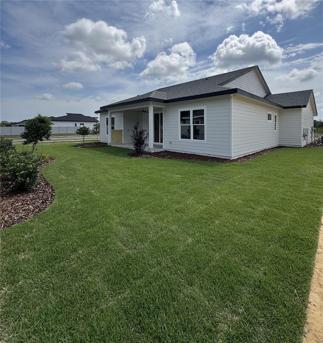 804 SW 144th Dr, Newberry, FL 32669 - back of property with a yard and a shingled roof