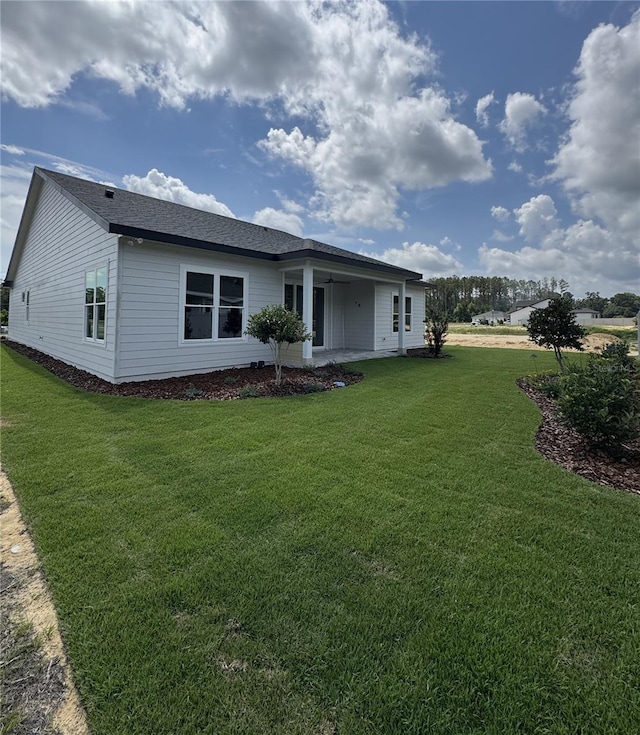 804 SW 144th Dr, Newberry, FL 32669 - rear view of property with a yard and a patio