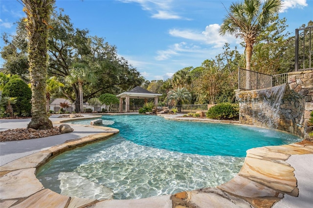 view of swimming pool with a gazebo and pool water feature