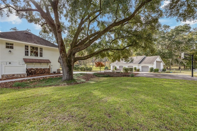 view of yard with a garage