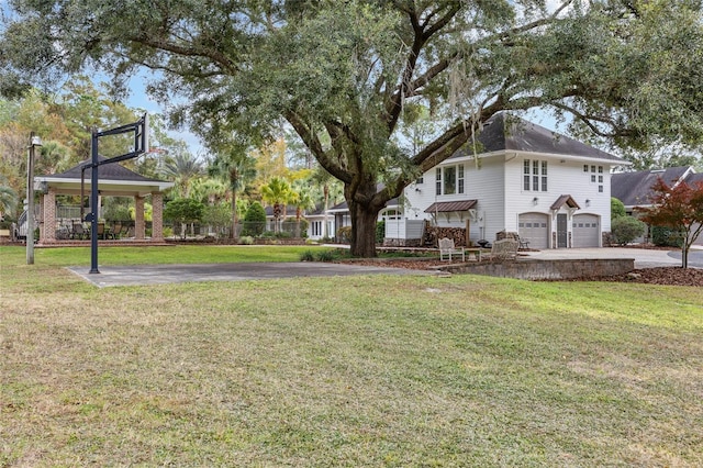 view of yard with a gazebo and a garage