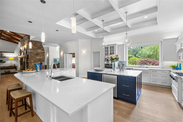 7106 NW 18th Ave, Gainesville, FL 32605 - kitchen with a sink, tasteful backsplash, a large island, fridge, and blue cabinetry