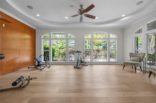7106 NW 18th Ave, Gainesville, FL 32605 - workout room with a tray ceiling, light wood finished floors, crown molding, and a ceiling fan