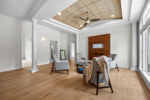 7106 NW 18th Ave, Gainesville, FL 32605 - interior space featuring a tray ceiling, baseboards, decorative columns, and ceiling fan