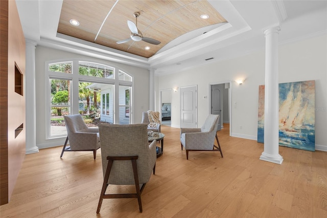 7106 NW 18th Ave, Gainesville, FL 32605 - living area with decorative columns, ceiling fan, light wood-type flooring, and a raised ceiling