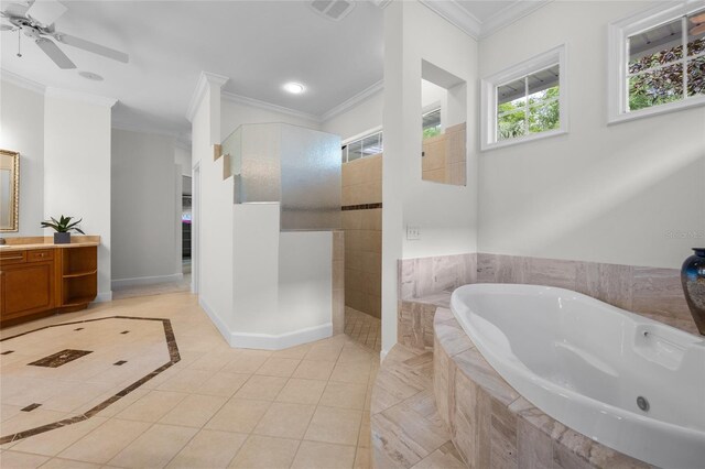 7106 NW 18th Ave, Gainesville, FL 32605 - bathroom with crown molding, tile patterned flooring, a bath, walk in shower, and baseboards
