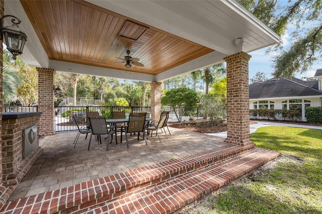 7106 NW 18th Ave, Gainesville, FL 32605 - view of patio featuring outdoor dining area, fence, and a ceiling fan