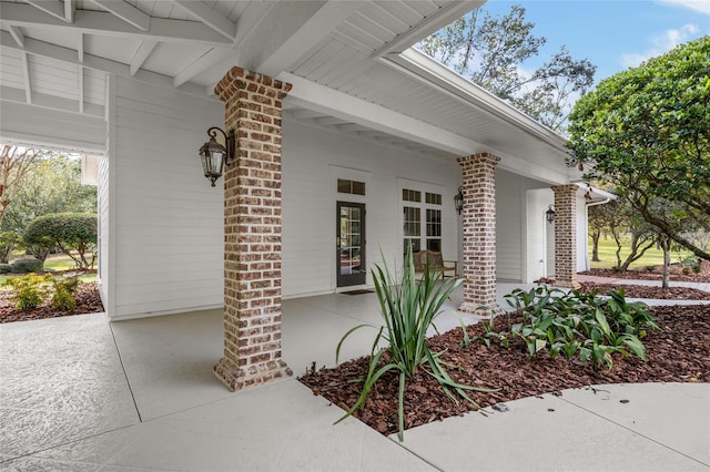 7106 NW 18th Ave, Gainesville, FL 32605 - doorway to property with a porch