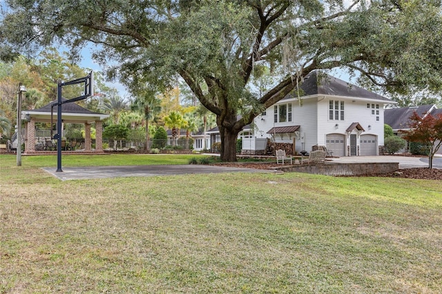 7106 NW 18th Ave, Gainesville, FL 32605 - view of yard featuring driveway and a garage