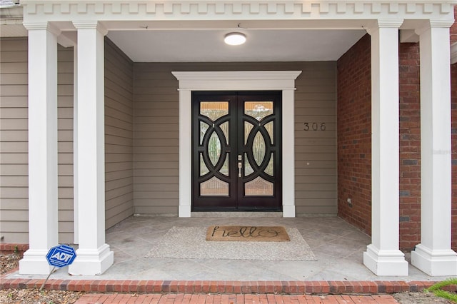 property entrance featuring covered porch