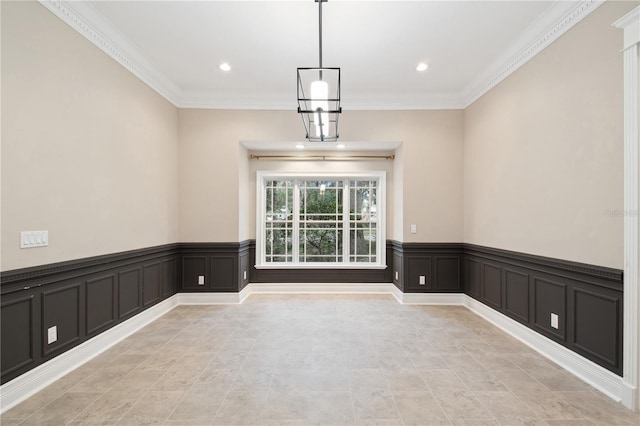 unfurnished dining area featuring crown molding