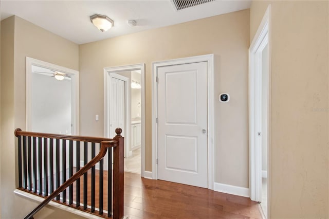 hallway with dark wood-type flooring