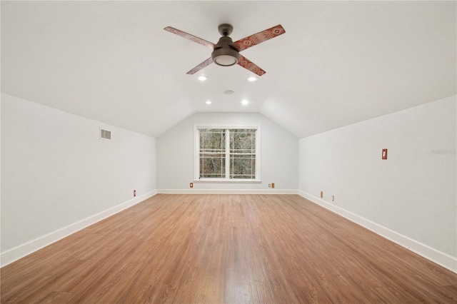 additional living space with ceiling fan, light hardwood / wood-style floors, and lofted ceiling