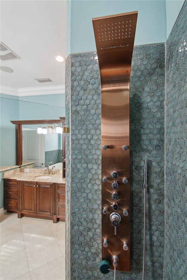 bathroom with vanity, tile patterned floors, and ornamental molding