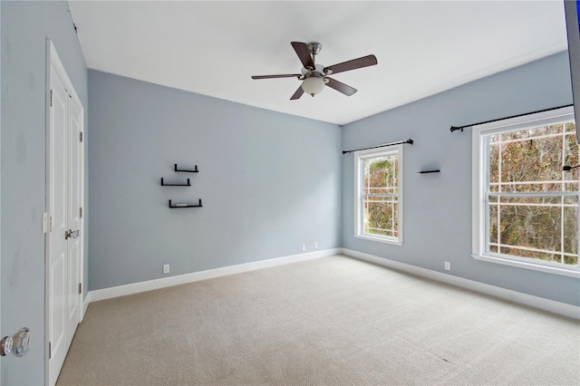 carpeted empty room with ceiling fan