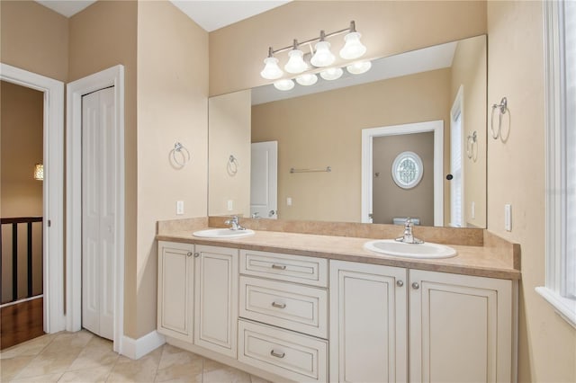 bathroom featuring tile patterned flooring and vanity