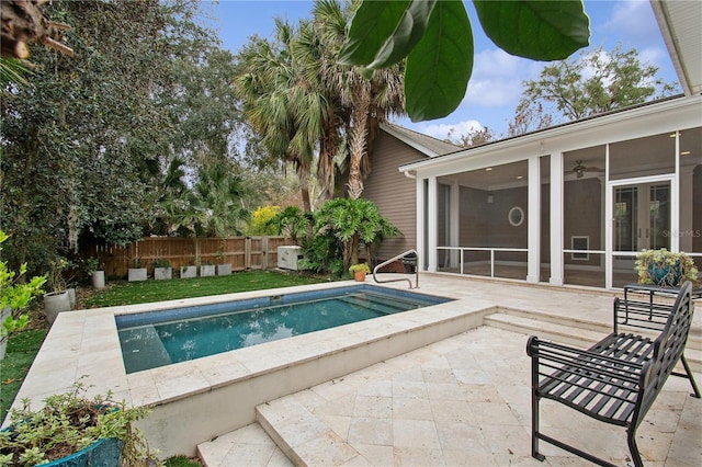 view of pool featuring a sunroom and a patio area