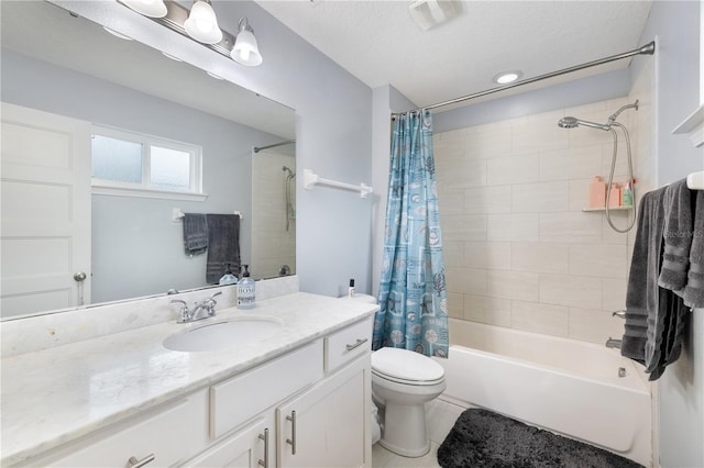 full bathroom featuring tile patterned floors, vanity, a textured ceiling, shower / tub combo with curtain, and toilet