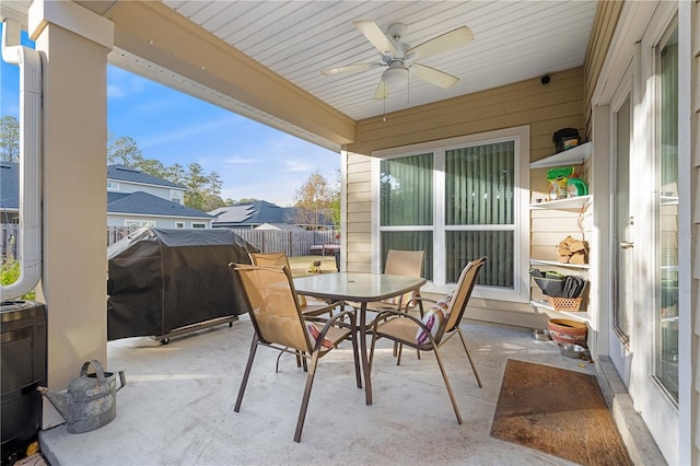 sunroom / solarium featuring ceiling fan