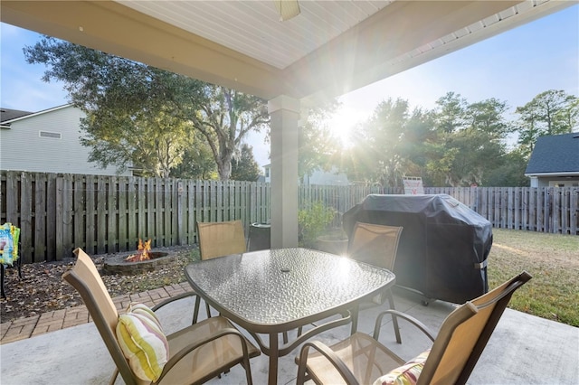 view of patio / terrace featuring a grill and a fire pit