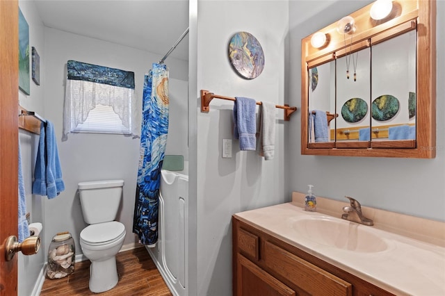 bathroom featuring a shower with curtain, vanity, hardwood / wood-style floors, and toilet