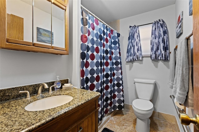 bathroom with vanity, toilet, and a shower with shower curtain