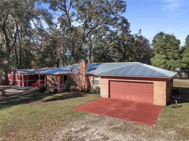 ranch-style house featuring a garage and a front yard