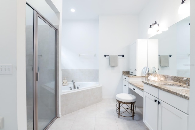 bathroom with tile patterned floors, vanity, and plus walk in shower