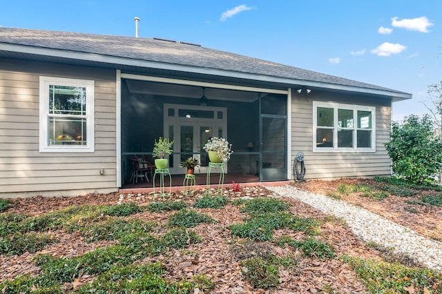 back of property featuring a sunroom