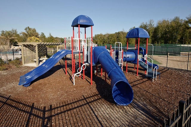 community jungle gym featuring fence