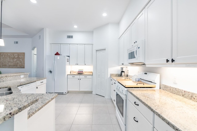 kitchen featuring white appliances, visible vents, white cabinets, hanging light fixtures, and light stone countertops