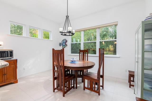 dining area featuring a notable chandelier