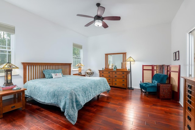 bedroom with dark wood-style floors and ceiling fan