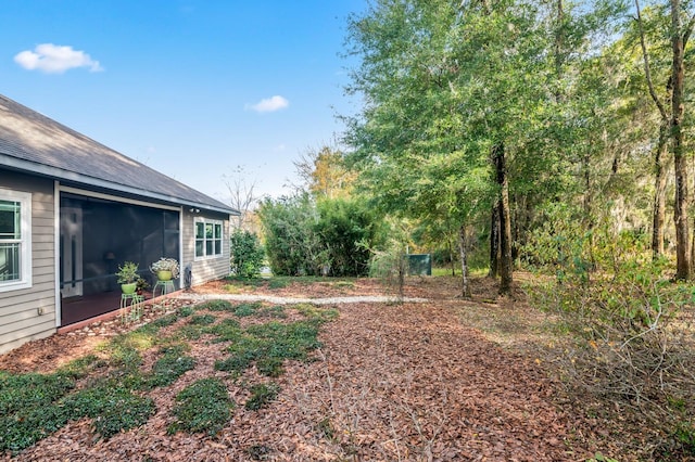 view of yard with a sunroom