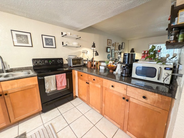 kitchen featuring dark stone counters, a textured ceiling, sink, light tile patterned floors, and black / electric stove