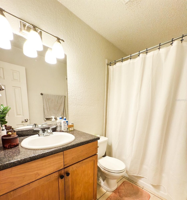 full bathroom featuring vanity, shower / bath combo, tile patterned floors, toilet, and a textured ceiling