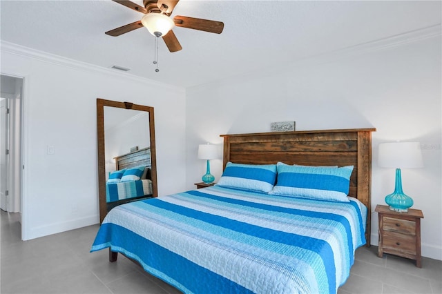 tiled bedroom with ceiling fan and crown molding