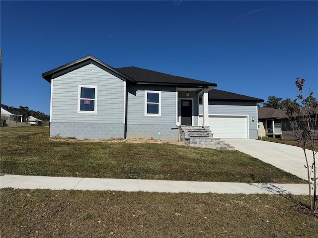 view of front of house with a front lawn and a garage