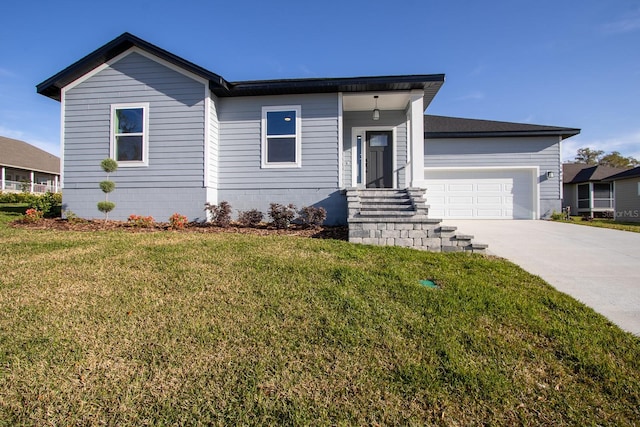 view of front of property featuring concrete driveway, an attached garage, and a front yard