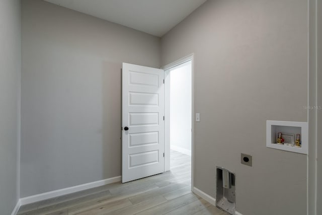 washroom with baseboards, laundry area, electric dryer hookup, washer hookup, and light wood-type flooring