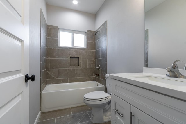 bathroom with tile patterned flooring, toilet, vanity, and bathtub / shower combination