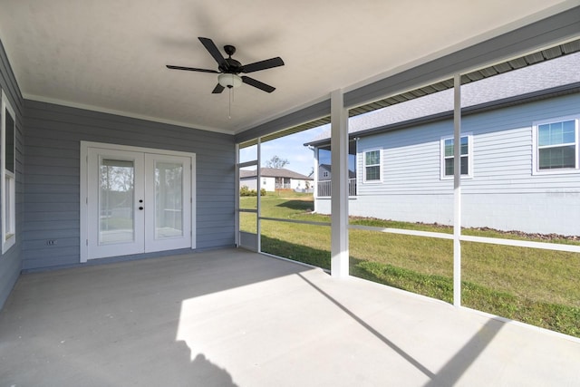 unfurnished sunroom featuring french doors and a ceiling fan