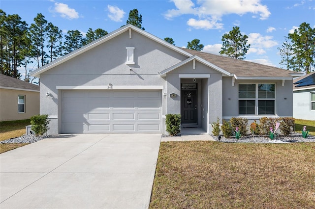 view of front of property featuring a garage and a front lawn