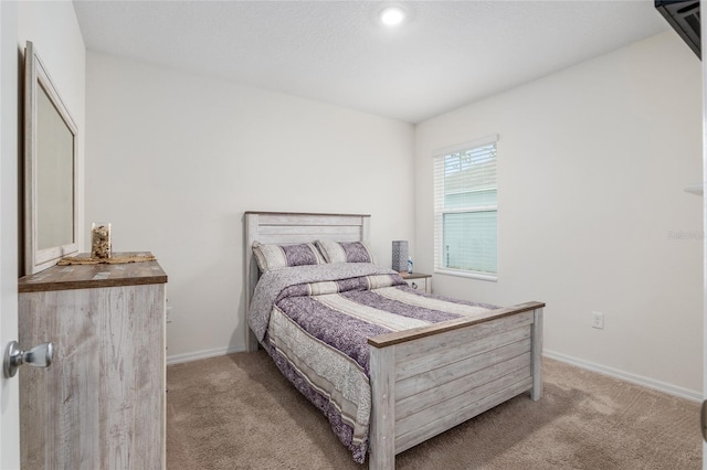 bedroom with light colored carpet